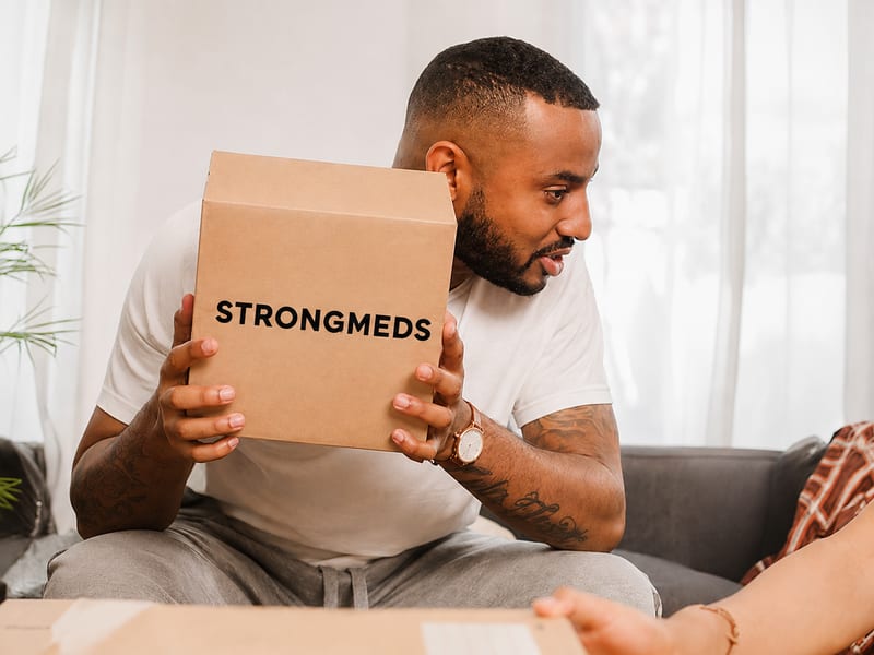 Woman receiving her medication delivery at her door